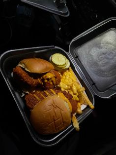 two trays filled with different types of food