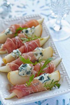 pears and prosciutto with blue cheese on them