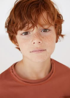 a young boy with freckles on his face