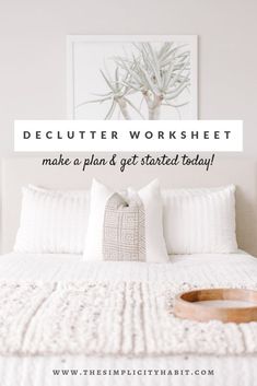 a bed with white sheets and pillows in front of a framed photograph that says, declutter worksheet make a plan & get started today