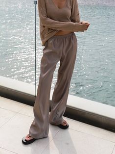 Chic and luxurious silky trousers with wide leg. Super comfortable. Wide leg creates relaxed flowing pants that are easy to wear. Model is in MINUSEY ONE SIZE. ✔️ Free worldwide express shipping over $100 ✔️ Loved by 6,500+ customers ✔️ Limited edition collections, maximum style ⠀⠀⠀⠀⠀⠀⠀⠀⠀ Stay ahead of the trend with can’t-find-anywhere-else staples. Your closet will thank you 💕 * MINUSEY ONE SIZE = EU 34-38, US2-6* 100% Polyester* Dry clean* Made in Korea - Model Height: 172cm/5'7" (US2, EU34) Silk Wide-leg Pants For Summer, Silk Wide Leg Pants With Elastic Waistband, Wide Leg Silk Pants With Elastic Waistband, Casual Silk Wide Leg Pants For Spring, Silk Wide Leg Pants For Summer, Spring Silk Loungewear Pants, Spring Silk Lounge Pants, Silk Loungewear Pants For Spring, Wide Leg Rayon Lounge Pants