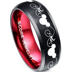 a black and red wedding ring with mickey mouse engraved on the inside, in white lettering