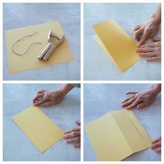 four pictures showing how to make an origami heart with scissors and paper on the floor