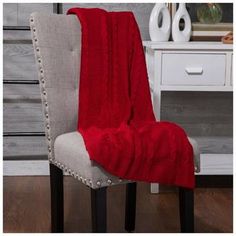 a chair with a red blanket on it