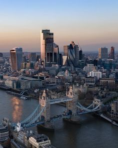 an aerial view of london with the tower bridge in the foreground