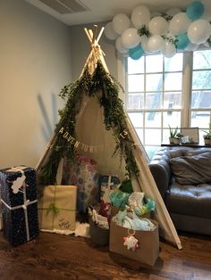 a teepee tent with presents on the floor