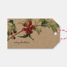 a christmas gift tag with holly and berries