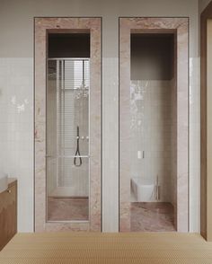 a bathroom with two glass doors that are open