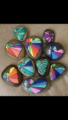 colorful painted rocks are arranged in a circle