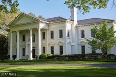 a large white house with columns on the front