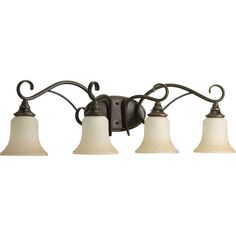 three light bathroom fixture with white glass shades on the top and bottom, in an antique bronze finish