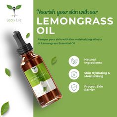 a bottle of lemongrass oil with green leaves around it