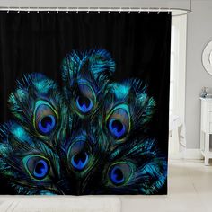 a shower curtain with peacock feathers on it