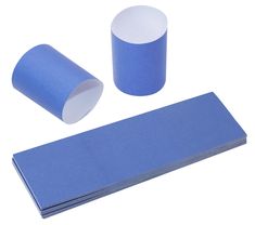 two rolls of blue paper next to each other