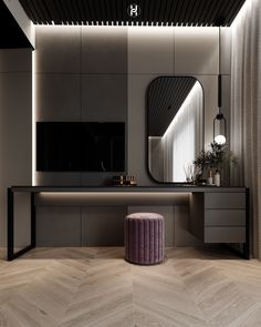 a bathroom with a vanity, mirror and stool in the corner next to it is lit up by lights