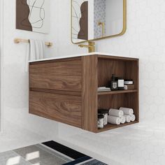 a bathroom with white tile and wooden cabinets, toiletries and mirror on the wall