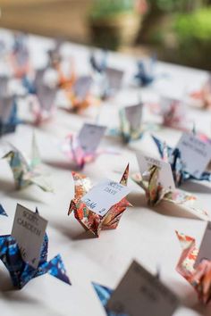 many origami birds are on the table