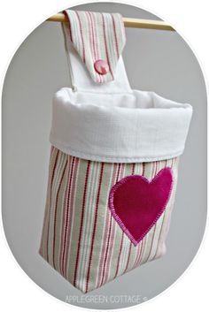 a bag with a heart on it hanging from a clothesline