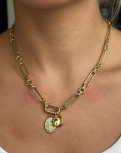 "Chunky Gold Chain Necklace Connected by a Twisted Carabiner with 3 Charms: a Blue Speckled Oval, a Mini Locket, and a Small Hammered Imperfect Oval. This beautifully ornate piece is bound to attract all sorts of attention and compliments! This necklace is feminine, bold, and unique all at the same time. It can be layered with other chains for a stacked look, or worn alone as a simply elegant statement piece. The charms can also be taken off, and put back on with ease.  💭Materials: Lead & nickel free always Chain is 24k Gold filled (and quite resistant to tarnishing)  Charms are 24k Gold plated 💭Length: 18\" in the listings photos & videos  **If you would like the necklace to be longer or shorter than 18\", please specify in the personalization section the length you would like instead. Gold Link Locket Jewelry, Chunky Gold Chain Necklace, Chunky Gold Chain, Gold Locket, Dream Jewelry, Gold Chain Necklace, Pretty Jewellery