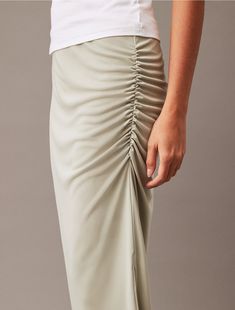 Cut in a flattering, fitted silhouette, this skirt is accentuated by soft ruching details at the waist. Designed in a midi length and styled with a medium rise waist. Made from smooth jersey fabric for a fluid touch.  Material: 100% Polyester. Fitted Silhouette, Jersey Fabric, Midi Length, Midi Skirt, Calvin Klein, Skirt, Fabric, Design