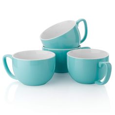 three tea cups and one bowl are stacked on top of each other