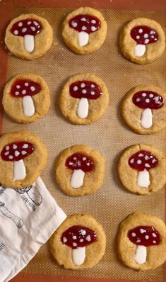 cookies with marshmallows and mushrooms on them are ready to go into the oven