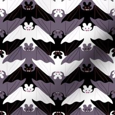 a bat pattern with black and white bats on it's back ground, in front of a purple background