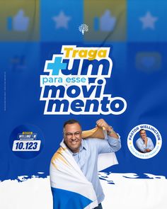 a man with a towel around his neck posing in front of a blue sign that says traga fun para esse movimentoo mento