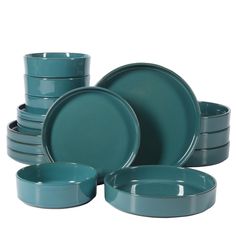 a set of green dishes and cups