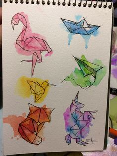 an artist's notebook with some origami animals on it