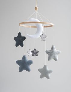 a mobile with stars, moon and crescent hanging from it