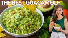 a woman holding a bowl of guacamole next to an avocado