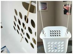 there are pictures on the wall and laundry basket in the bathroom with clothes pins hanging from it