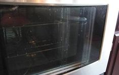 an oven is shown with the door open and it's glass doors still on