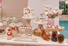 a table topped with lots of cakes and desserts