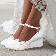 a close up of a person wearing wedges and white shoes with lace on them