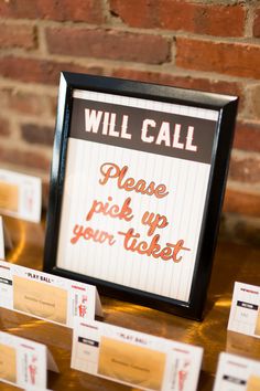 there is a sign that says will call please pick up your tickets on the table