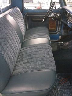 the interior of an old car with leather seats