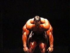 an image of a bodybuilding man in the dark with his hands on his hips