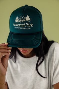 Designed for adventure, the National Park Trucker Hat has got a comfy adjustable snap-back strap and cool mesh for breezy wear. Choose from earthy shades and sport a retro national park graphic. Perfect for exploring the outdoors!! 100% polyester adjustable strap curved brim medium crown height medium stiffness Trucker Style Hat With Curved Brim For Travel, Trucker Hat With Curved Brim For Travel, Curved Brim Trucker Hat For Travel, Vintage Green Snapback Hat For Outdoor, Vintage Summer Trucker Hat For Outdoor Activities, Green Trucker Hat With Curved Brim For Travel, Green Trucker Hat For Outdoor Activities, Green Vintage Trucker Hat For Outdoor, Curved Bill Baseball Cap For Summer Camping