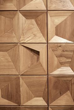 the wooden wall has many different shapes and sizes