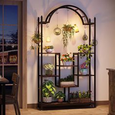 a shelf with potted plants on it in a room next to a table and window