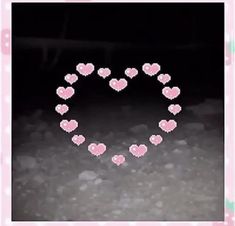 a heart made out of small pink hearts