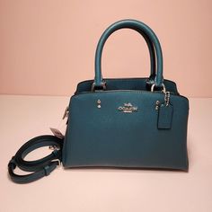 Coach Mini Lillie Carryall Color: Sv/Deep Turquoise Msrp: $398 * Crossgrain Leather * Center Zip Compartment * Snap Closure, Fabric Lining * Handles With 4 1/4" Drop * Outside Open Pocket * Detachable Strap With 21 1/2" Drop For Shoulder Or Crossbody Wear * Four Protective Feet At Base * 10 1/4" (L) X 6 3/4" (H) X 4 1/4" (W) Style No. 91146 Brown Coach Purse, Vintage Leather Handbag, Deep Turquoise, Base 10, Leather Duffle, Leather Shoulder Handbags, Coach Shoulder Bag, Carry All Bag, Suitcases