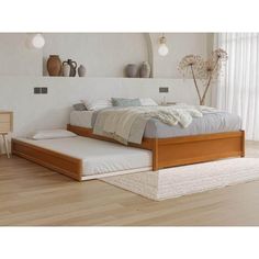 a bed sitting on top of a hard wood floor