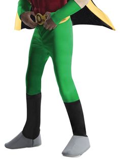 a man in green and black costume holding a pair of scissors on his right hand