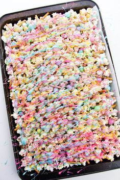 sprinkle covered cake sitting on top of a pan