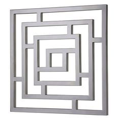 a square metal wall sculpture on a white background