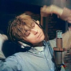 a young man wearing headphones listening to music