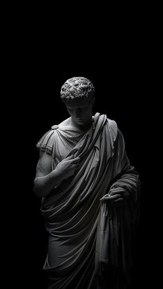 a black and white photo of a statue that looks like it is draped in cloth